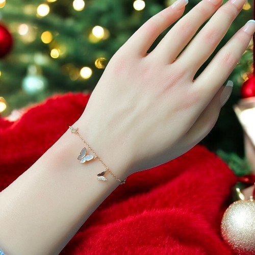Butterflies charm bracelet in a rose gold finish with charming star pendants crafted in 925 sterling silver 3