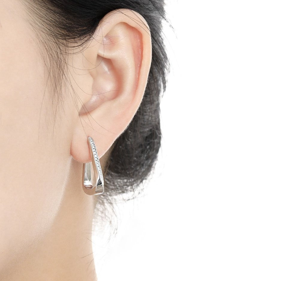 Amara Jewels Sterling Silver Geometric Crystal Hoop Earrings with sparkling crystals on the front edge.