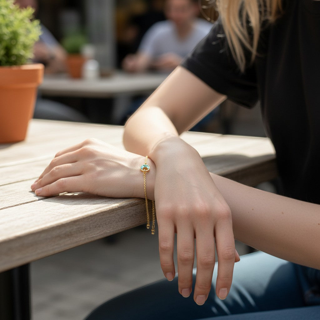 Amara Jewels gold-plated sterling silver bracelet with abalone shell crescent moon charm.