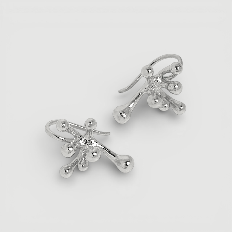Amara Jewels abstract fluid sterling silver earrings with a polished finish, evoking organic movement.