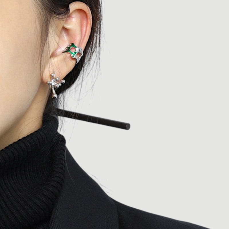 Amara Jewels abstract fluid sterling silver earrings with a polished finish, evoking organic movement.