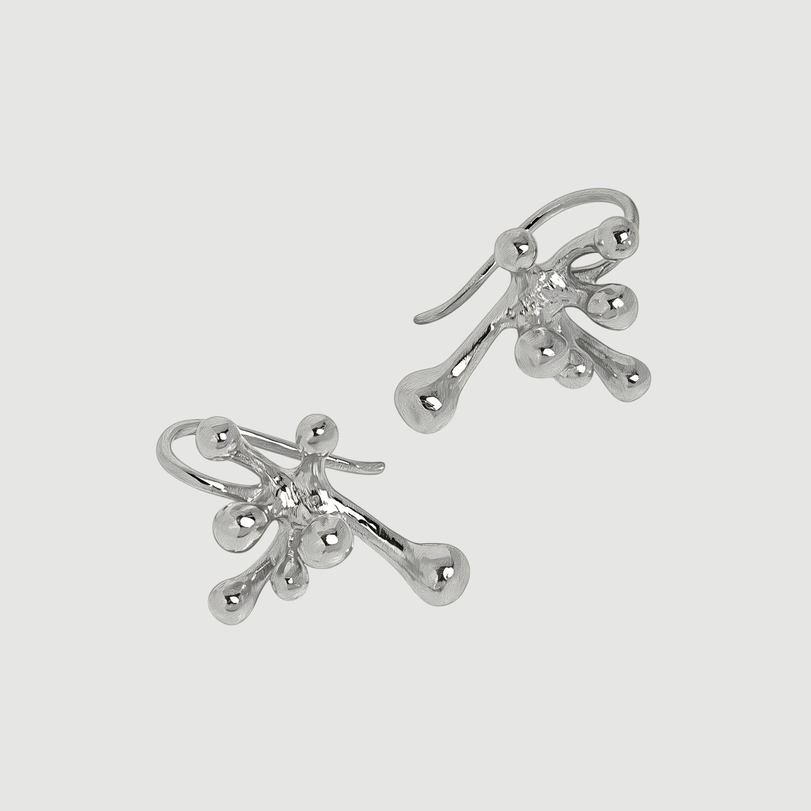 Amara Jewels abstract art earrings in polished sterling silver with a fluid, organic design.