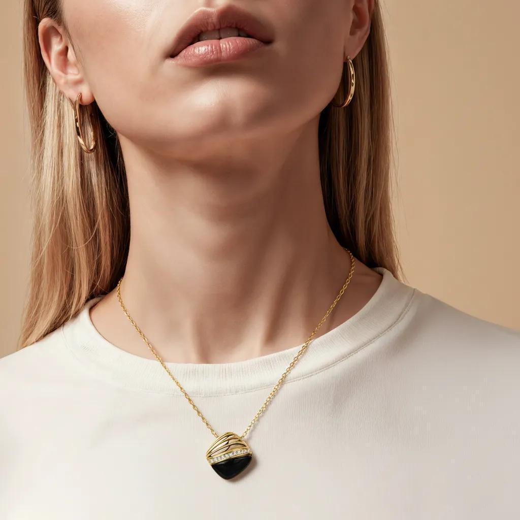 Amara Jewels gold 925 sterling silver necklace with black agate pendant, accented with crystals.