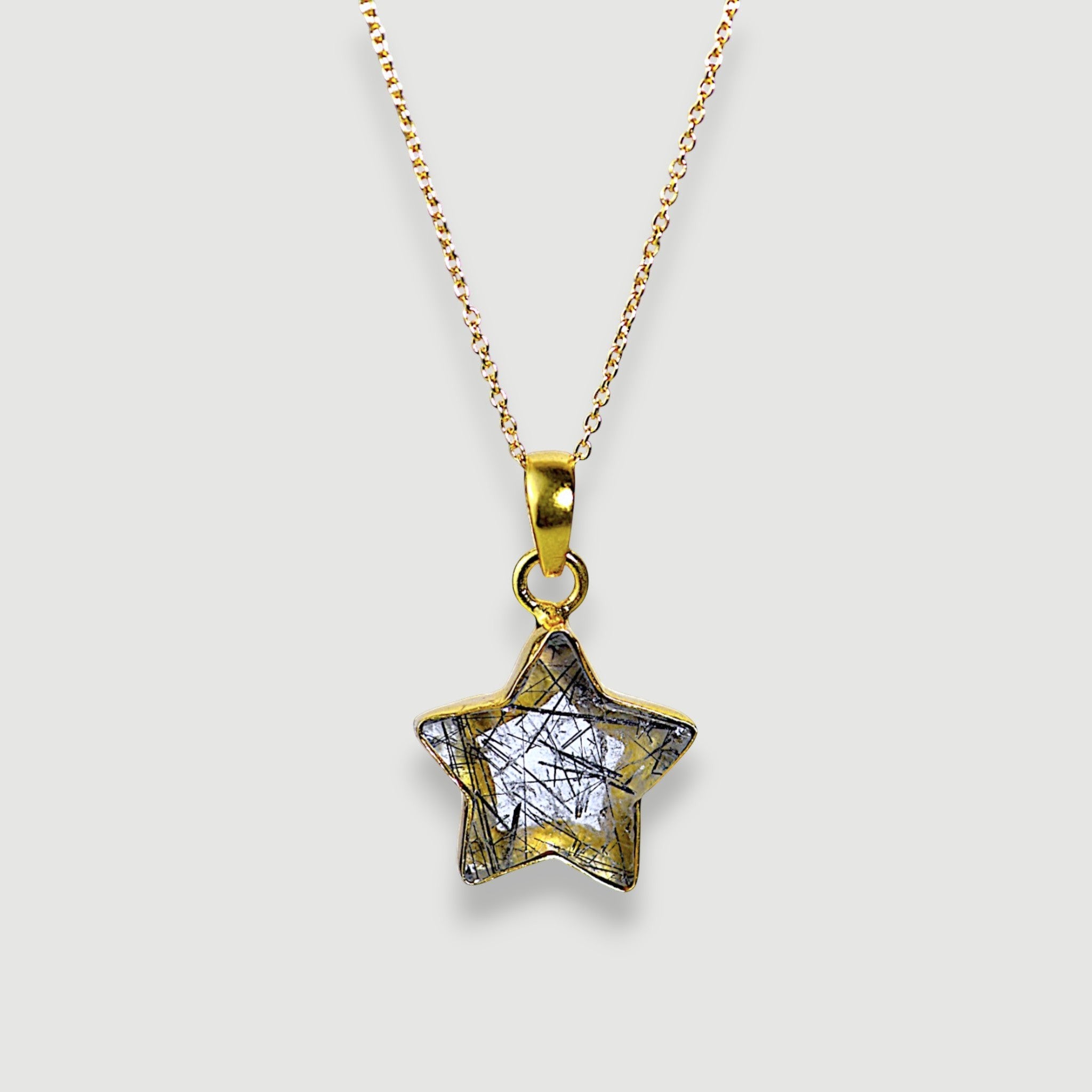 Amara Jewels star pendant necklace with black rutilated quartz and 18K gold vermeil chain.