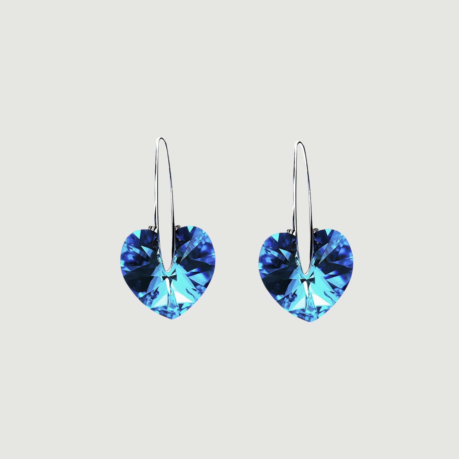 Amara Jewels blue heart-shaped crystal drop earrings with sterling silver hooks.