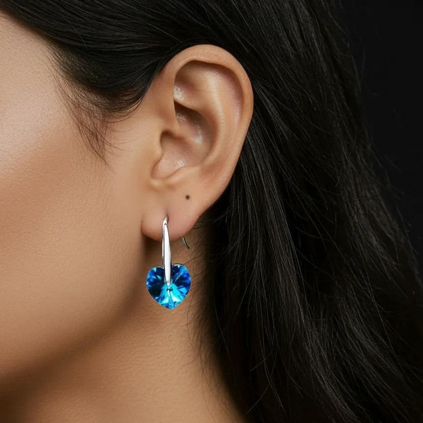 Amara Jewels blue heart-shaped crystal drop earrings with sterling silver hooks.