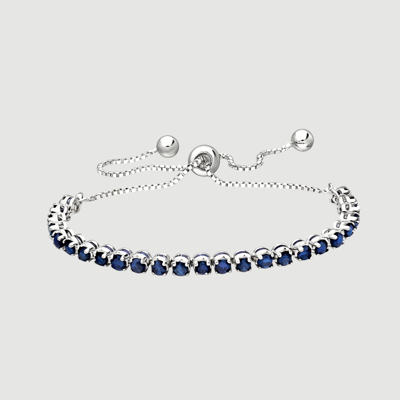 Amara Jewels sterling silver slider bracelet with deep blue sapphires and adjustable chain.