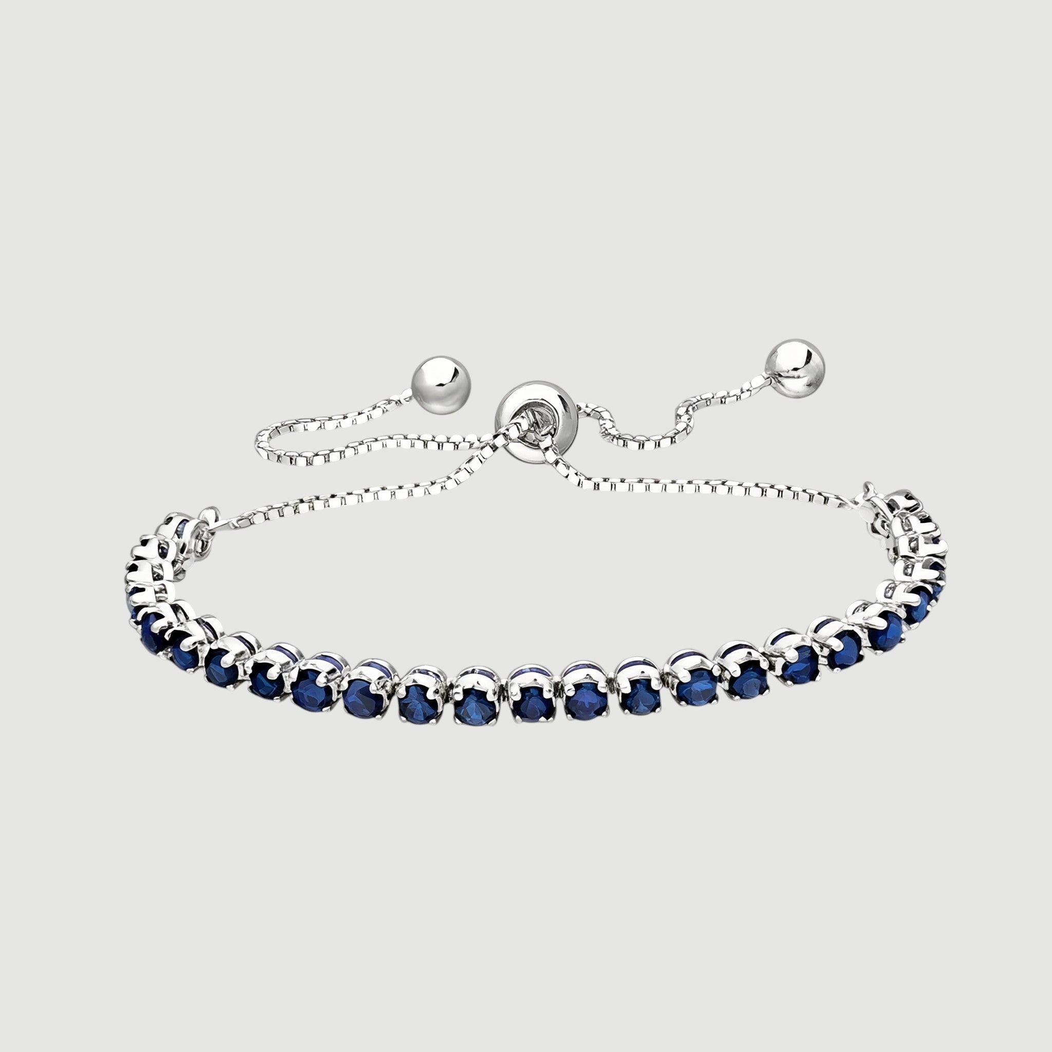 Amara Jewels sterling silver slider bracelet with deep blue sapphires and adjustable chain.