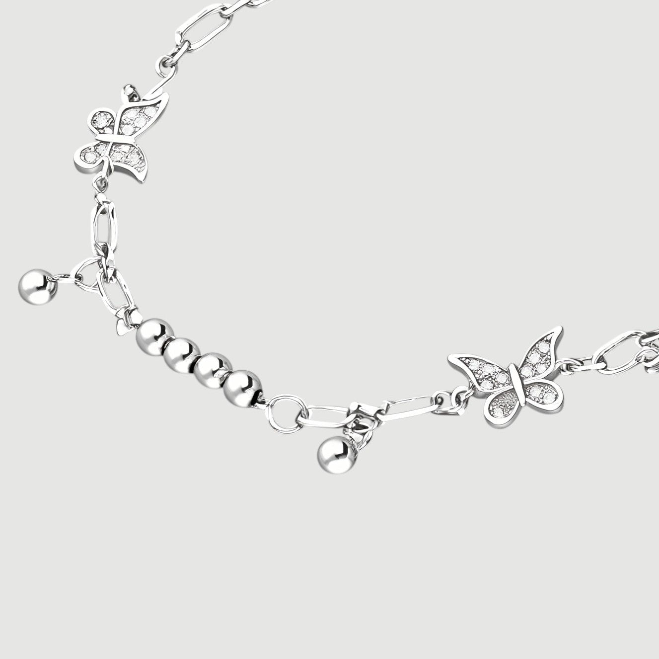 Amara Jewels sterling silver bracelet with delicate butterfly charms and polished silver beads, adjustable clasp.
