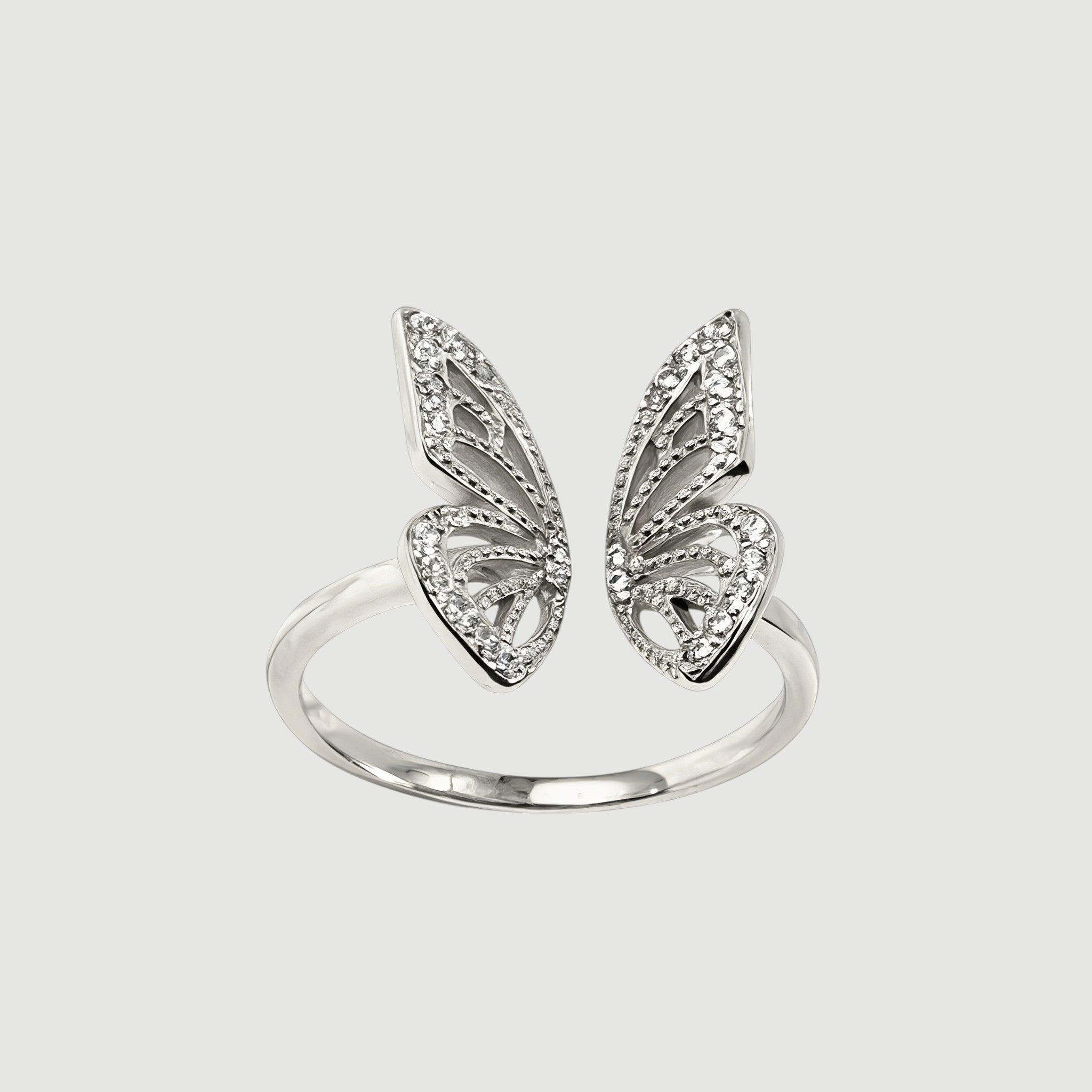 Amara Jewels 925 Sterling Silver open ring with delicate, openwork butterfly wings adorned with small crystals. Adjustable band.