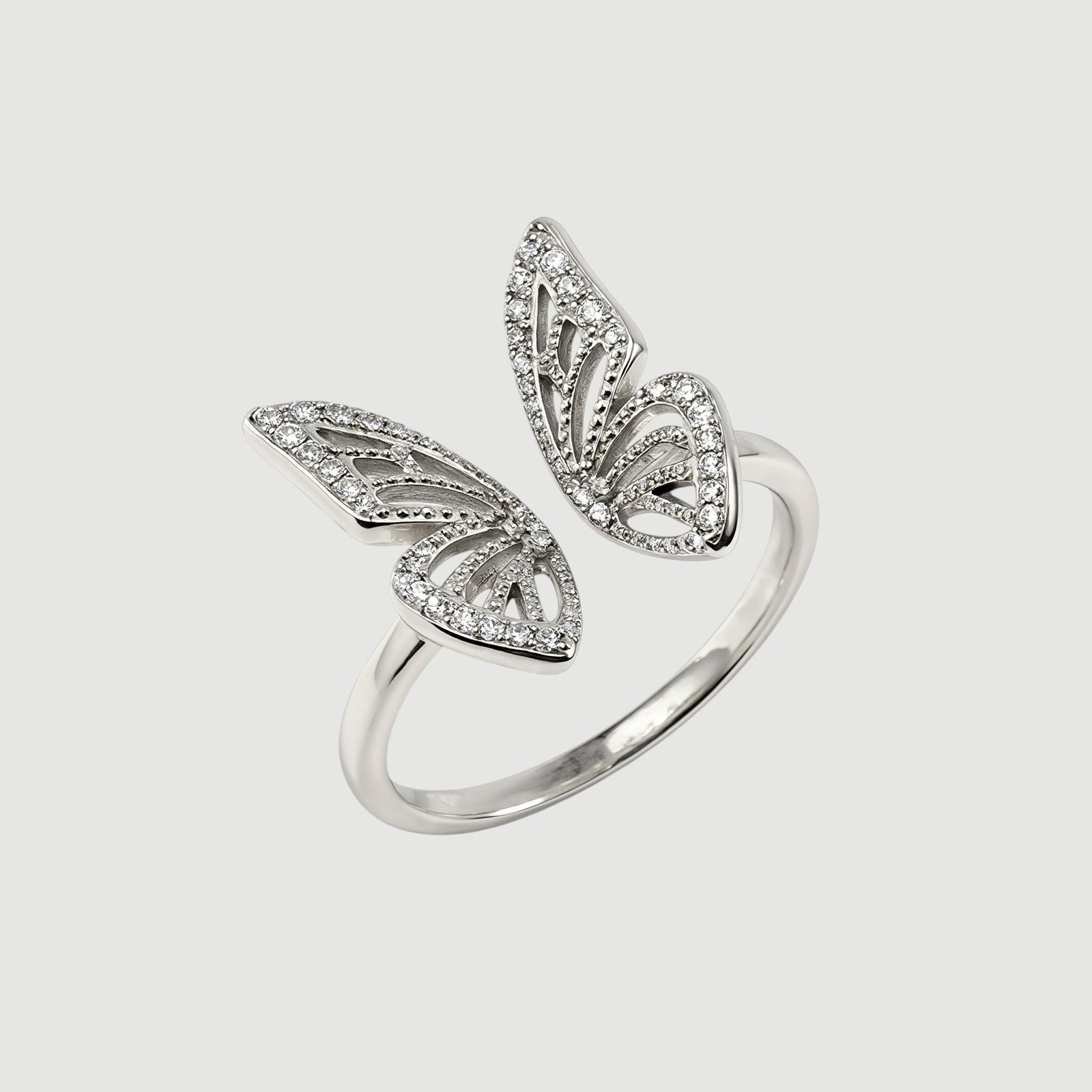 Amara Jewels 925 Sterling Silver open ring with delicate, openwork butterfly wings adorned with small crystals. Adjustable band.