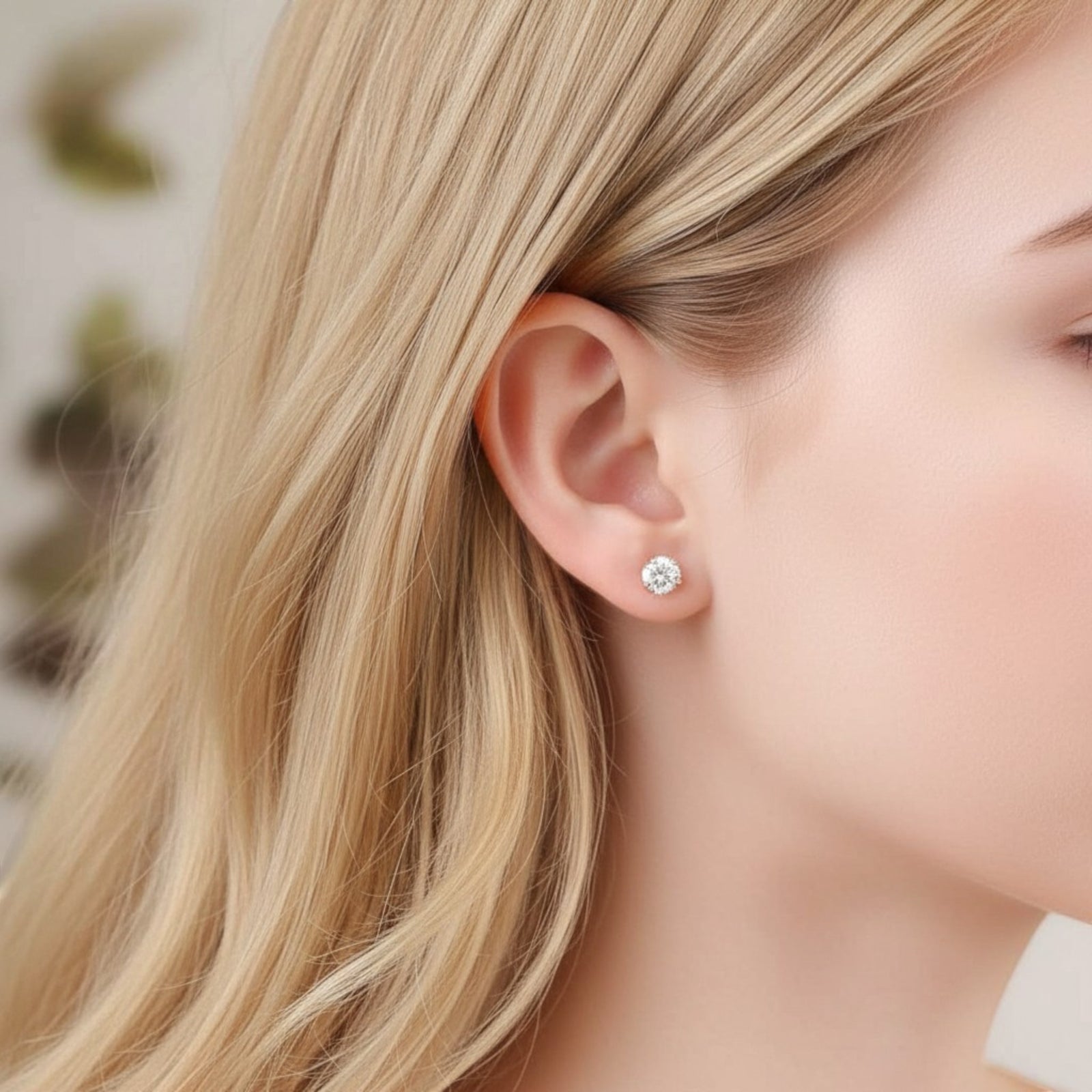 Amara Jewels champagne cubic zirconia stud earrings with round-cut stones in a four-prong setting.
