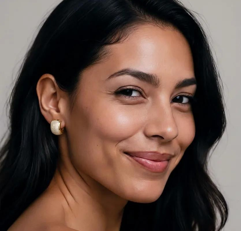 Amara Jewels champagne pearl stud earrings with textured gold plating and half-moon shape.