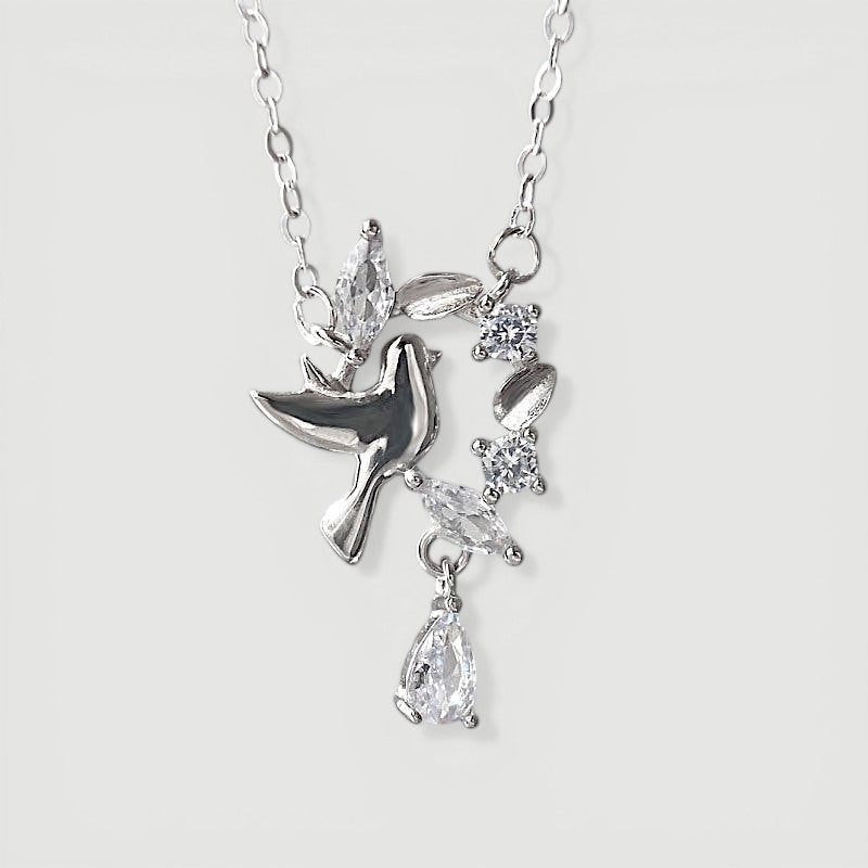 Amara Jewels 925 sterling silver dove pendant necklace with cubic zirconia accents, symbolizing peace and grace.