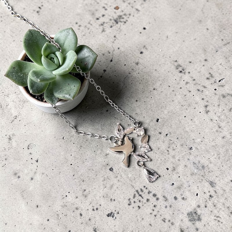 Amara Jewels 925 sterling silver dove pendant necklace with cubic zirconia accents, symbolizing peace and grace.