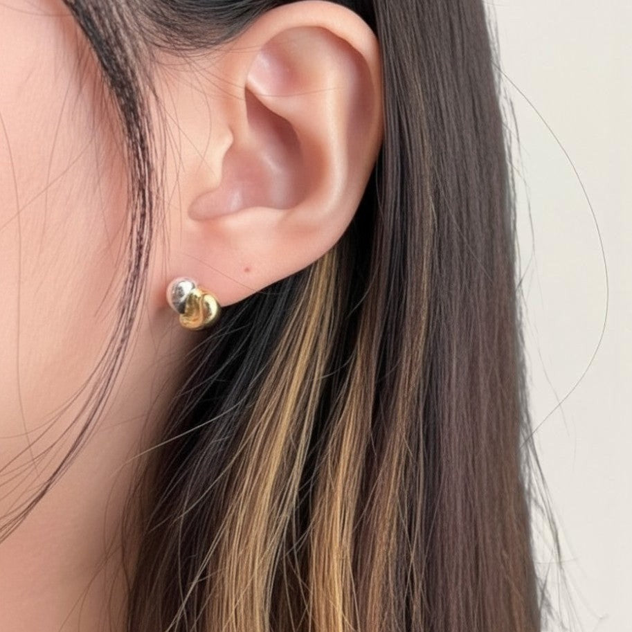 Amara Jewels dual-tone stud earrings in 18K gold-plated sterling silver with organic, fluid shape.