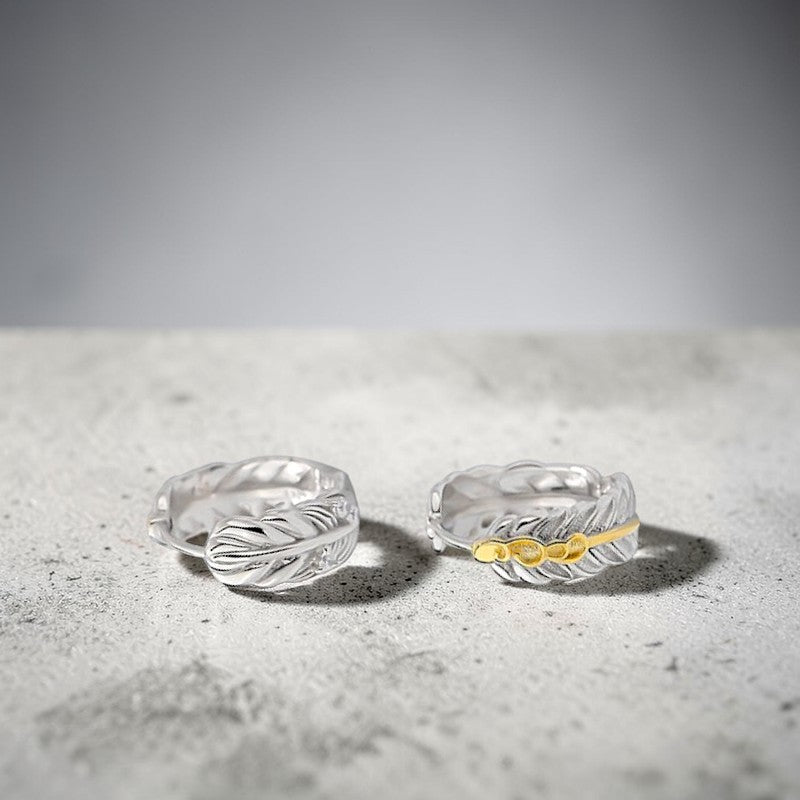 Amara Jewels Sterling Silver Feather Hoop Earrings with Gold Accent, detailed feather design.