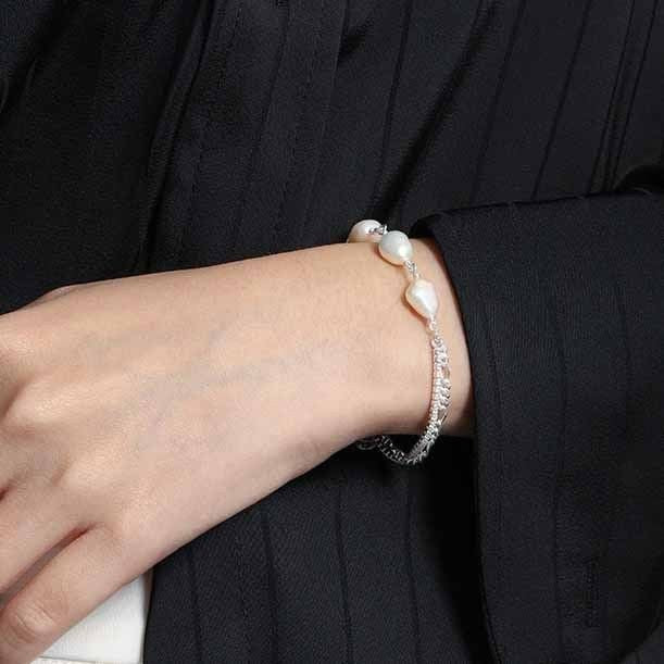 Amara Jewels 925 sterling silver bracelet with freshwater pearls and a dual chain design, one chain is accented with sparkling stones.