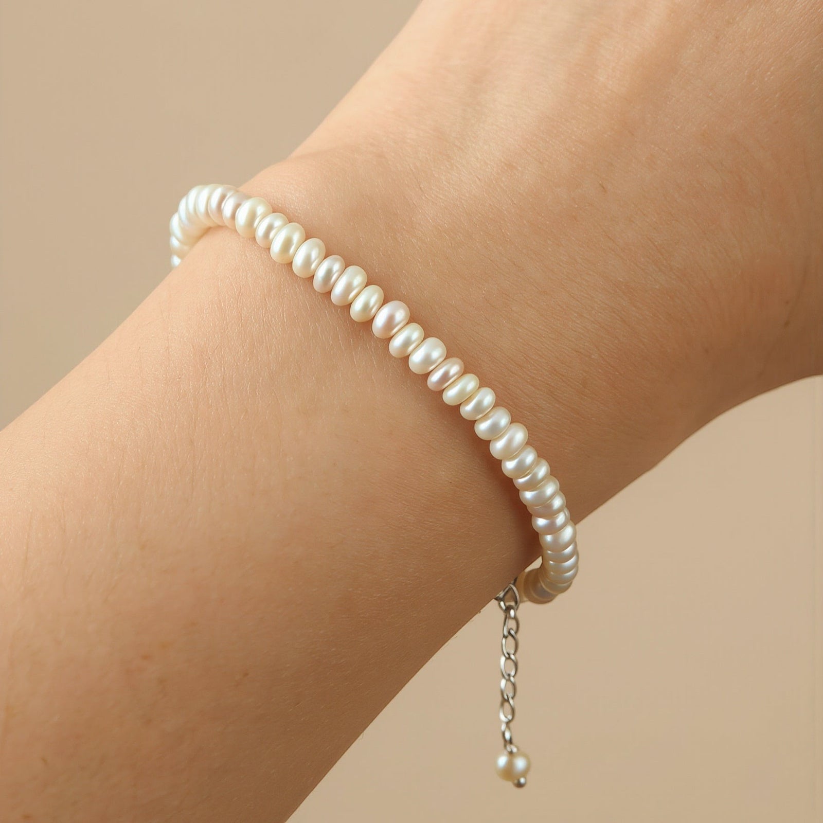 Amara Jewels Freshwater Pearl Bracelet with small, irregular white pearls and silver clasp, perfect for June birthdays.