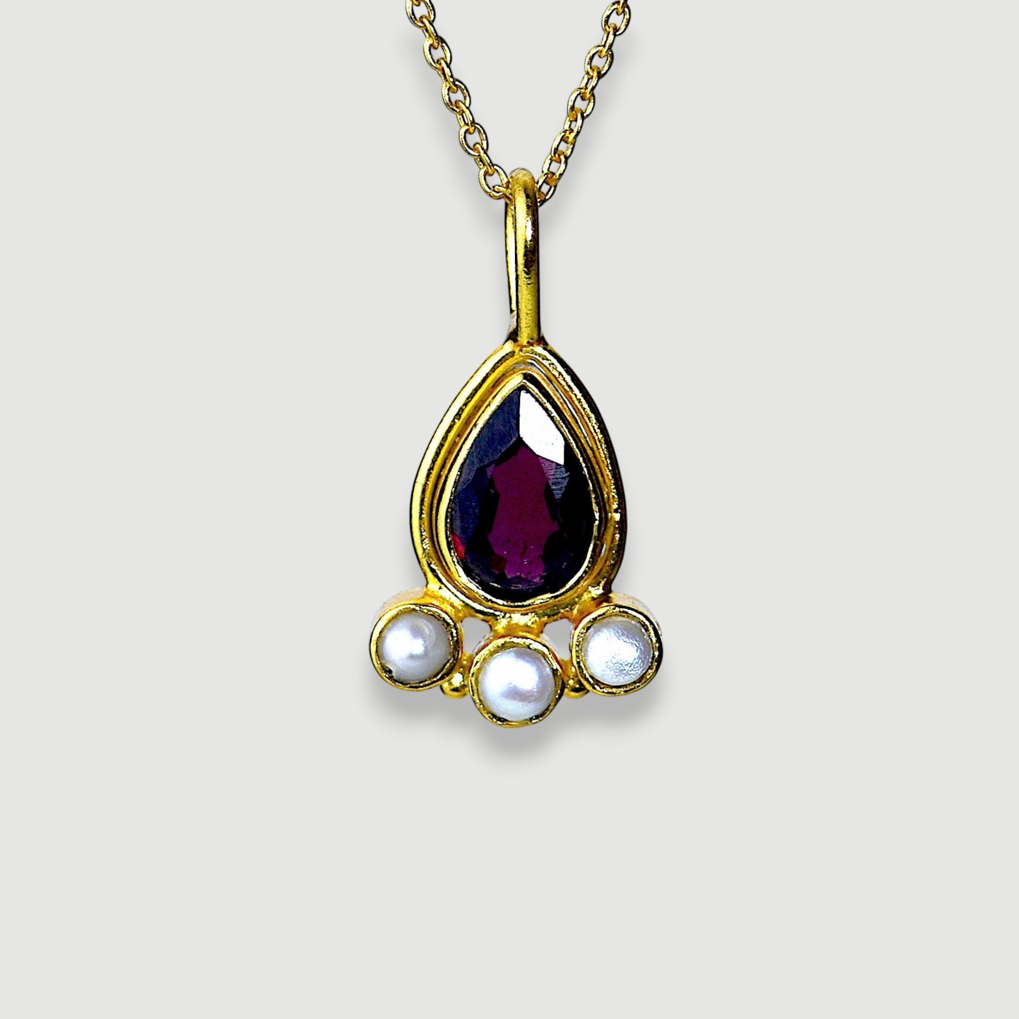 Amara Jewels teardrop necklace with deep red garnet and three pearls, set in 18K gold vermeil over sterling silver.