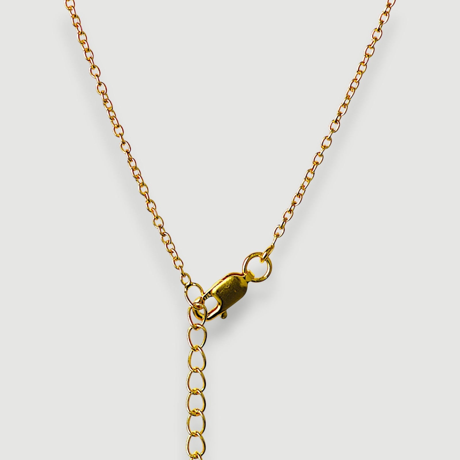 Amara Jewels teardrop necklace with deep red garnet and three pearls, set in 18K gold vermeil over sterling silver.