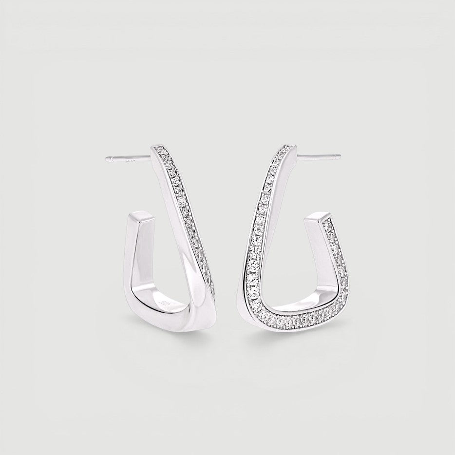 Amara Jewels Sterling Silver Geometric Crystal Hoop Earrings with sparkling crystals on the front edge.