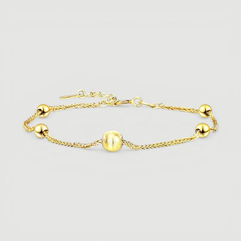 Amara Jewels gold-plated sterling silver bracelet with delicate chain and polished, textured beads.