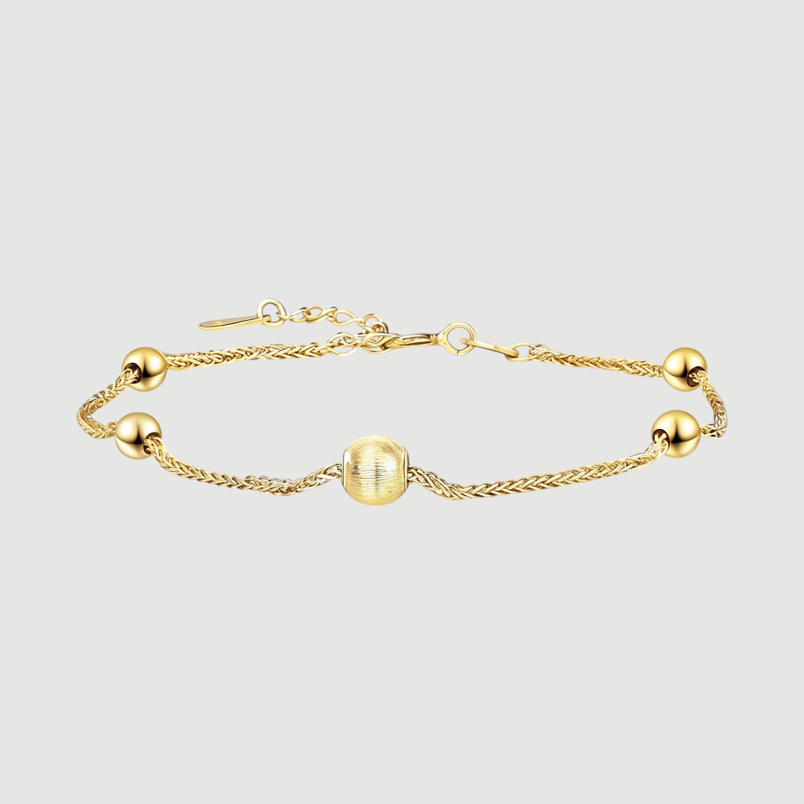 Amara Jewels gold-plated sterling silver bracelet with delicate chain and polished, textured beads.