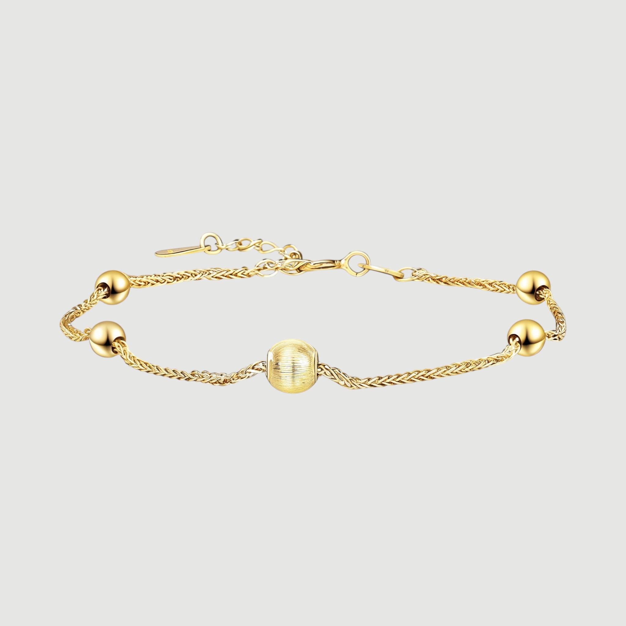 Amara Jewels gold-plated sterling silver bracelet with delicate chain and polished, textured beads.