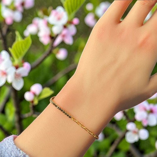 Amara Jewels gold-plated sterling silver bracelet with dual chain and black accents.