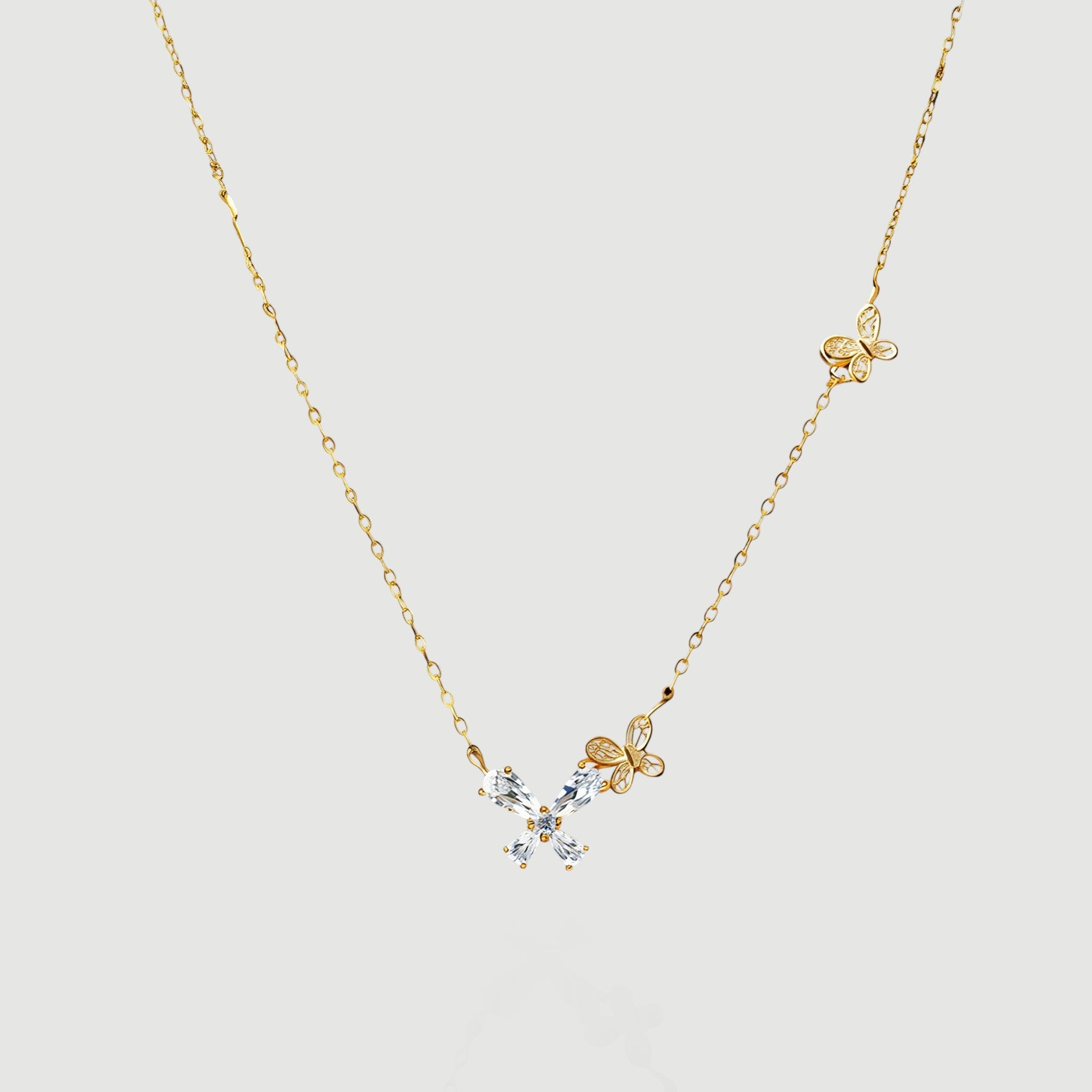 Amara Jewels gold-tone sterling silver necklace with butterfly and floral design, accented with cubic zirconia.