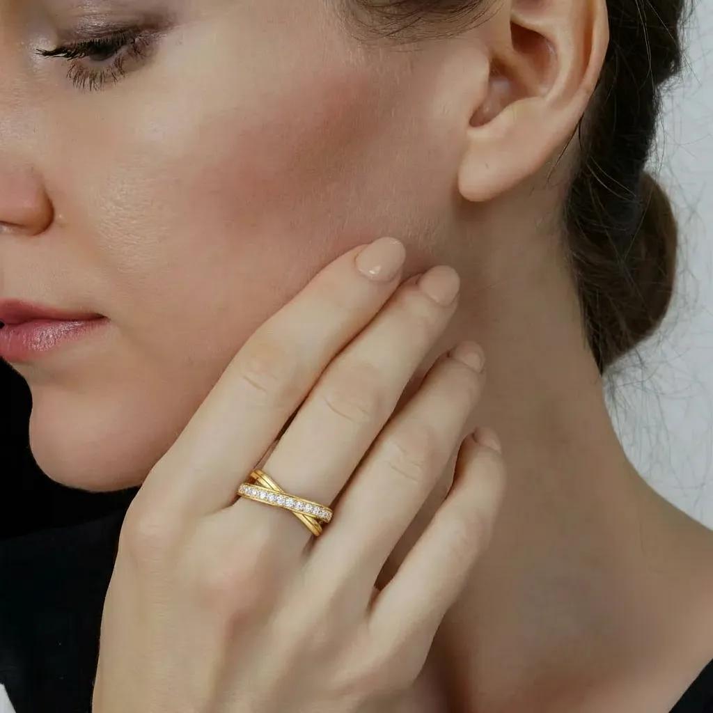 Amara Jewels gold-tone 925 sterling silver criss-cross ring with pavé cubic zirconia stones.