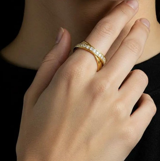 Amara Jewels gold-tone 925 sterling silver criss-cross ring with pavé cubic zirconia stones.