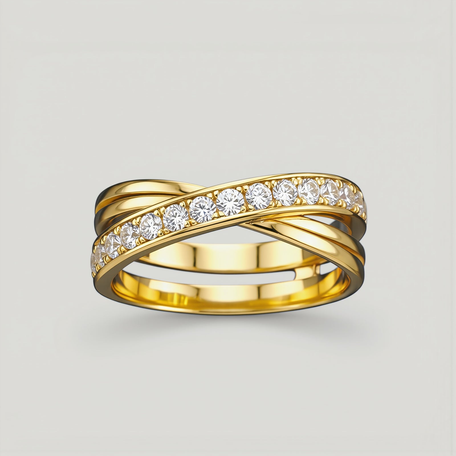 Amara Jewels gold-tone 925 sterling silver criss-cross ring with pavé cubic zirconia stones.