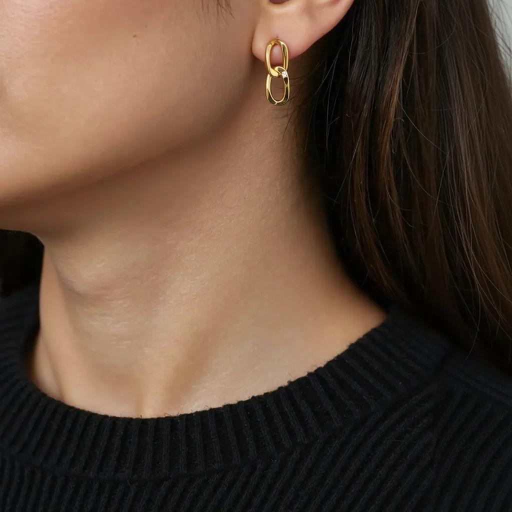 Amara Jewels gold-plated sterling silver double link drop earrings with cubic zirconia accent.