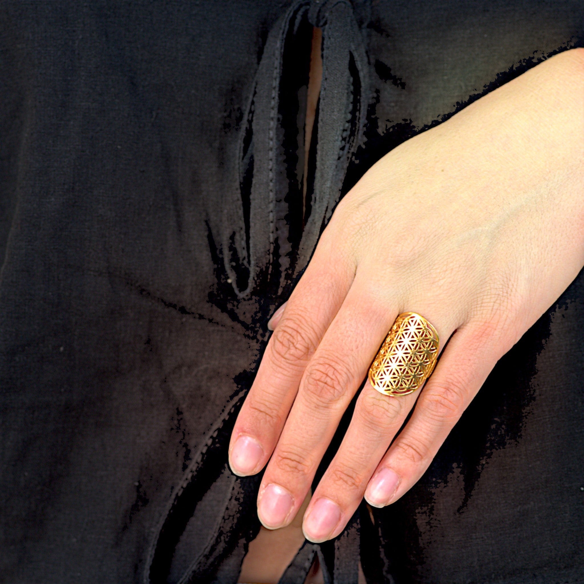 Amara Jewels gold vermeil statement ring with floral cutout pattern and sacred geometry design.