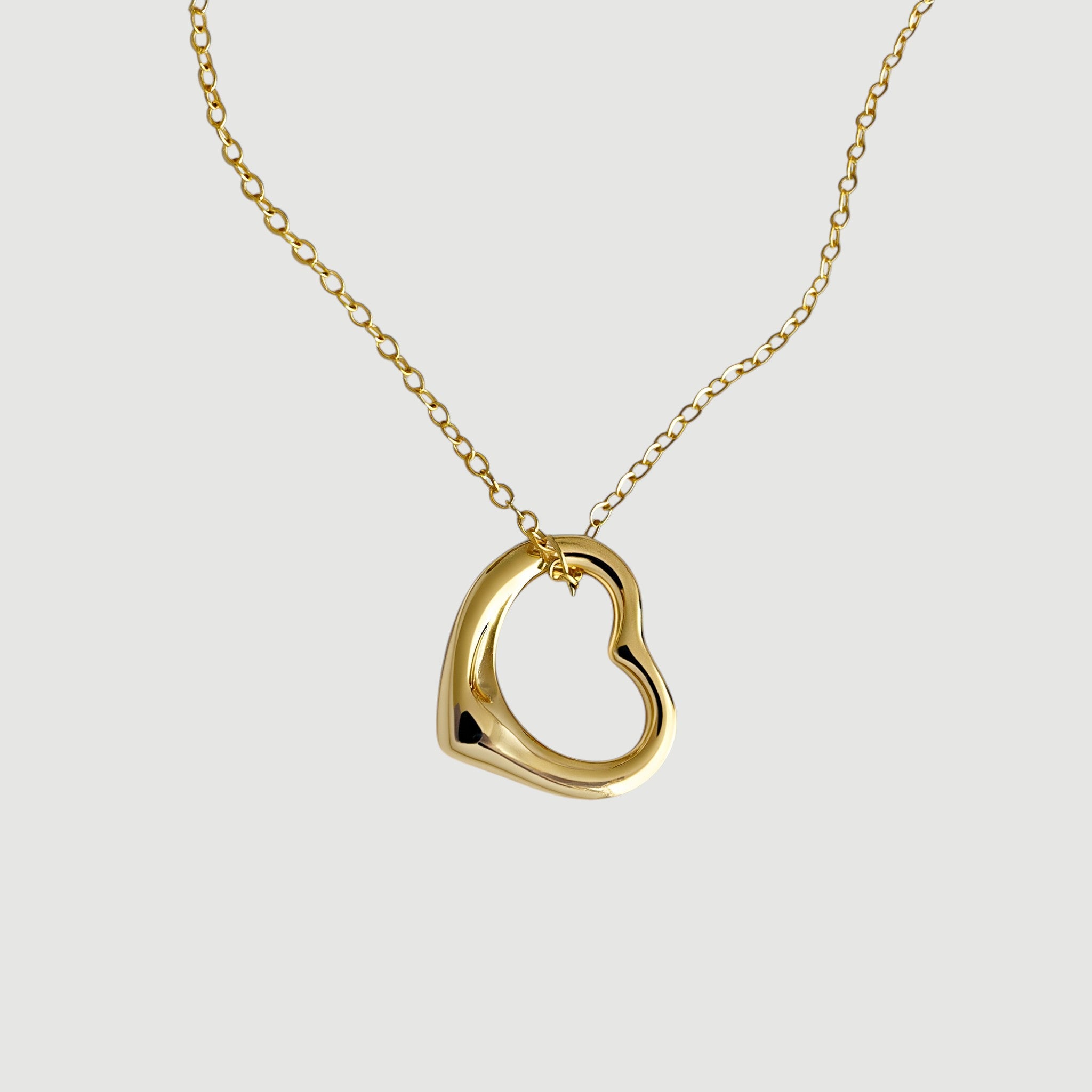 Amara Jewels gold-plated sterling silver hollow heart pendant necklace on a delicate chain.