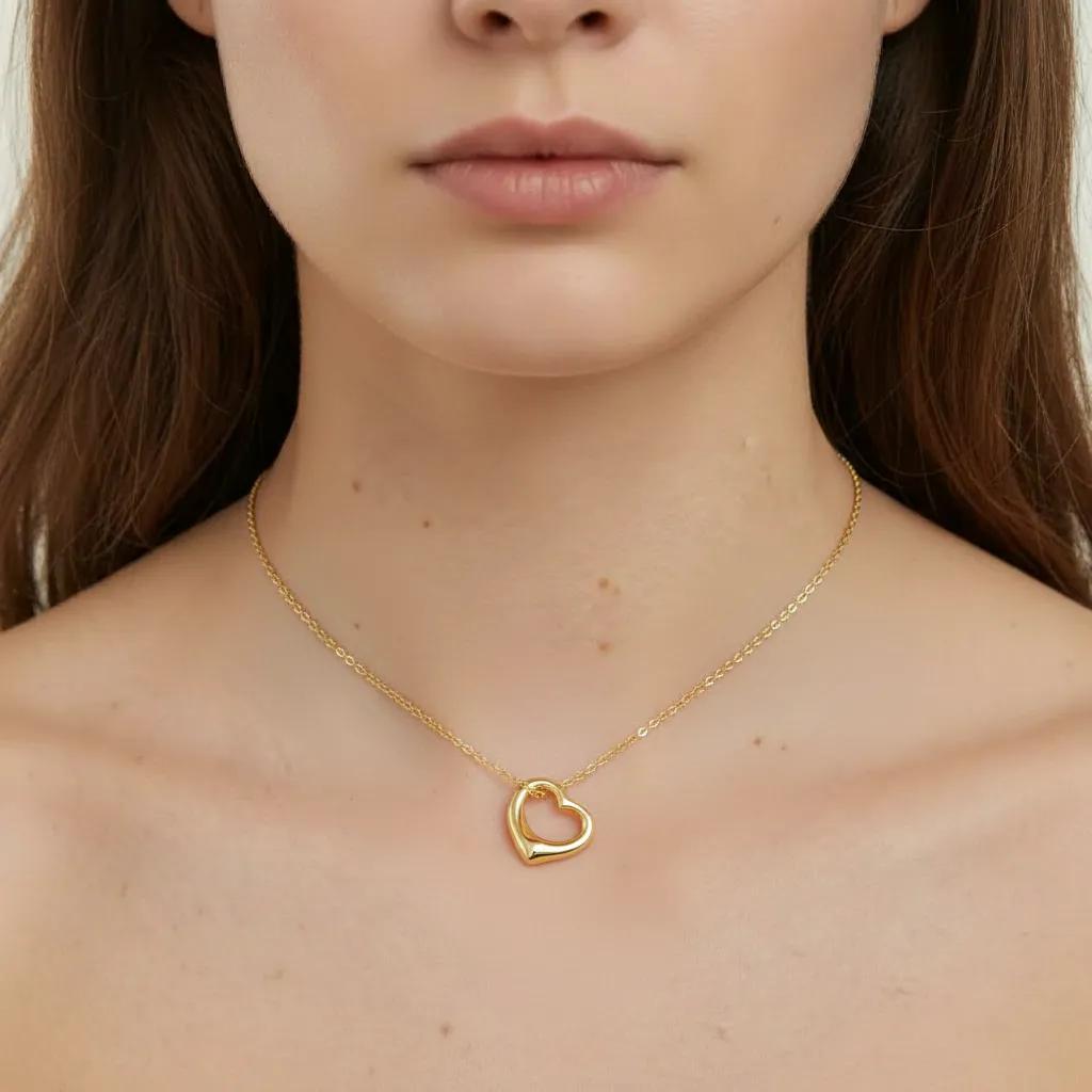 Amara Jewels gold-plated sterling silver hollow heart pendant necklace on a delicate chain.
