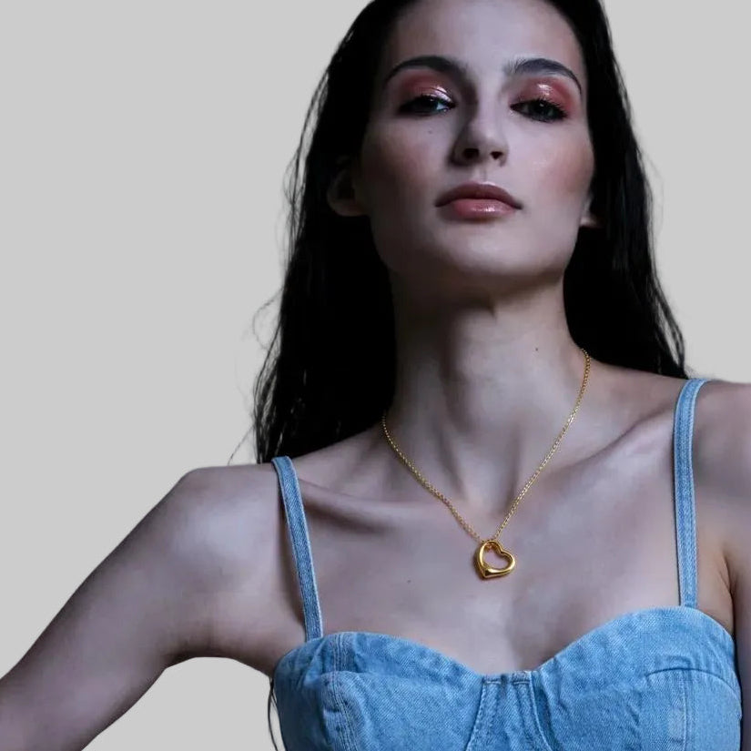 Amara Jewels gold-plated sterling silver hollow heart pendant necklace on a delicate chain.