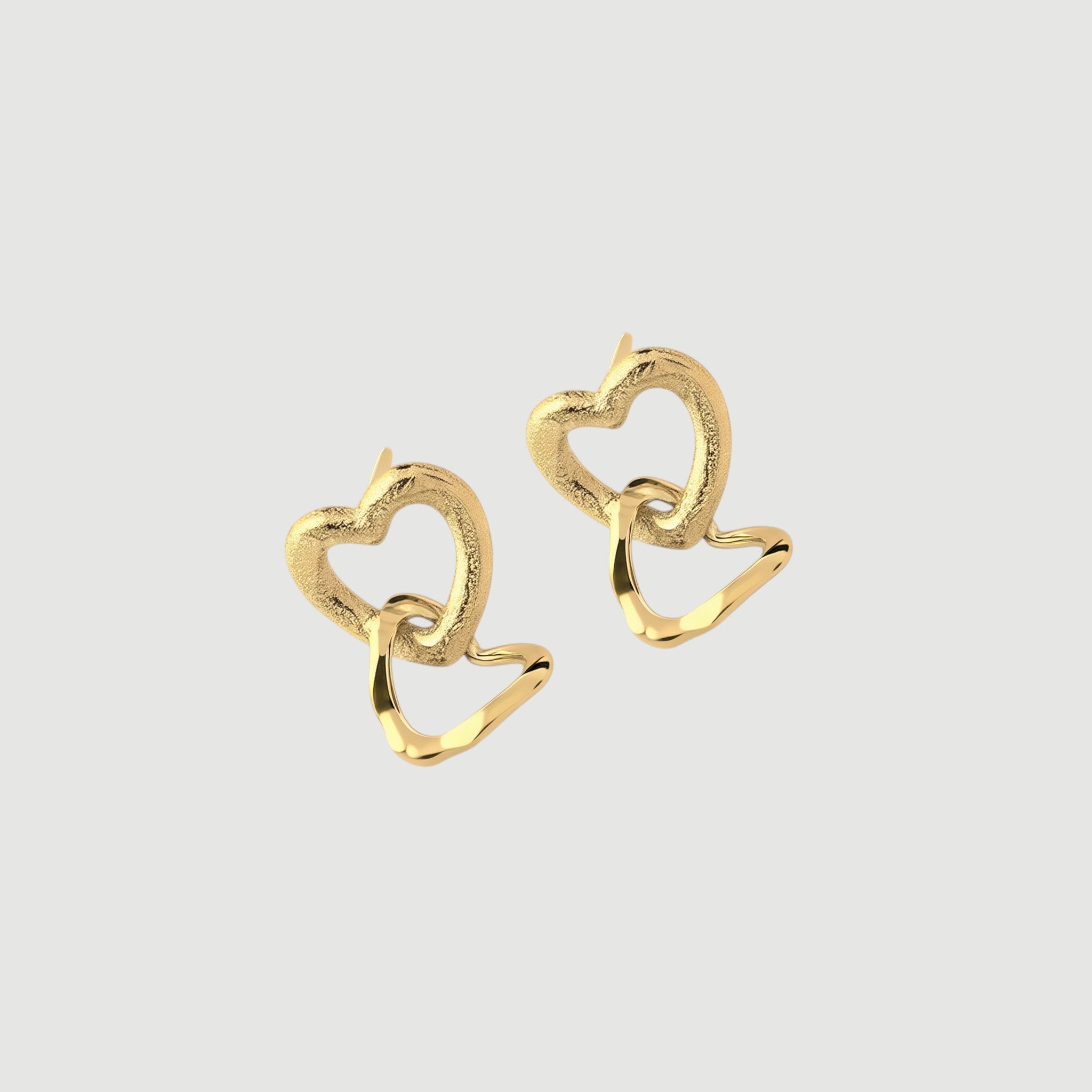 Amara Jewels gold-vermeil sterling silver interlocking heart earrings with textured and polished finishes.
