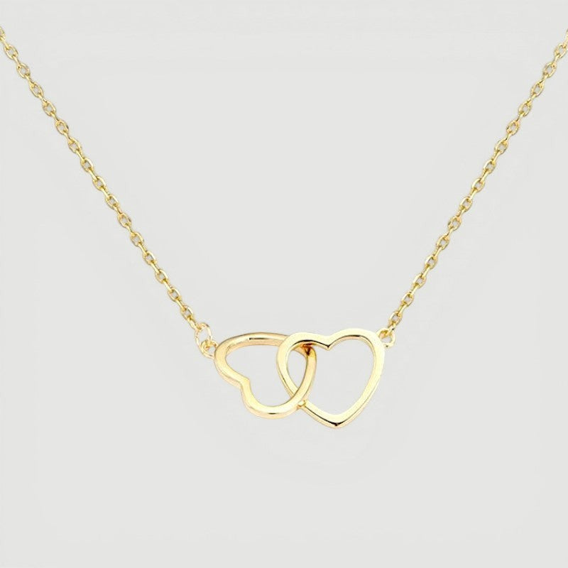 Amara Jewels interlocking hollow hearts necklace in gold, symbolizing connection and affection.