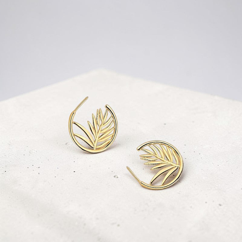 Amara Jewels gold-plated sterling silver hoop earrings with intricate palm leaf design. Elegant, nature-inspired statement jewelry.