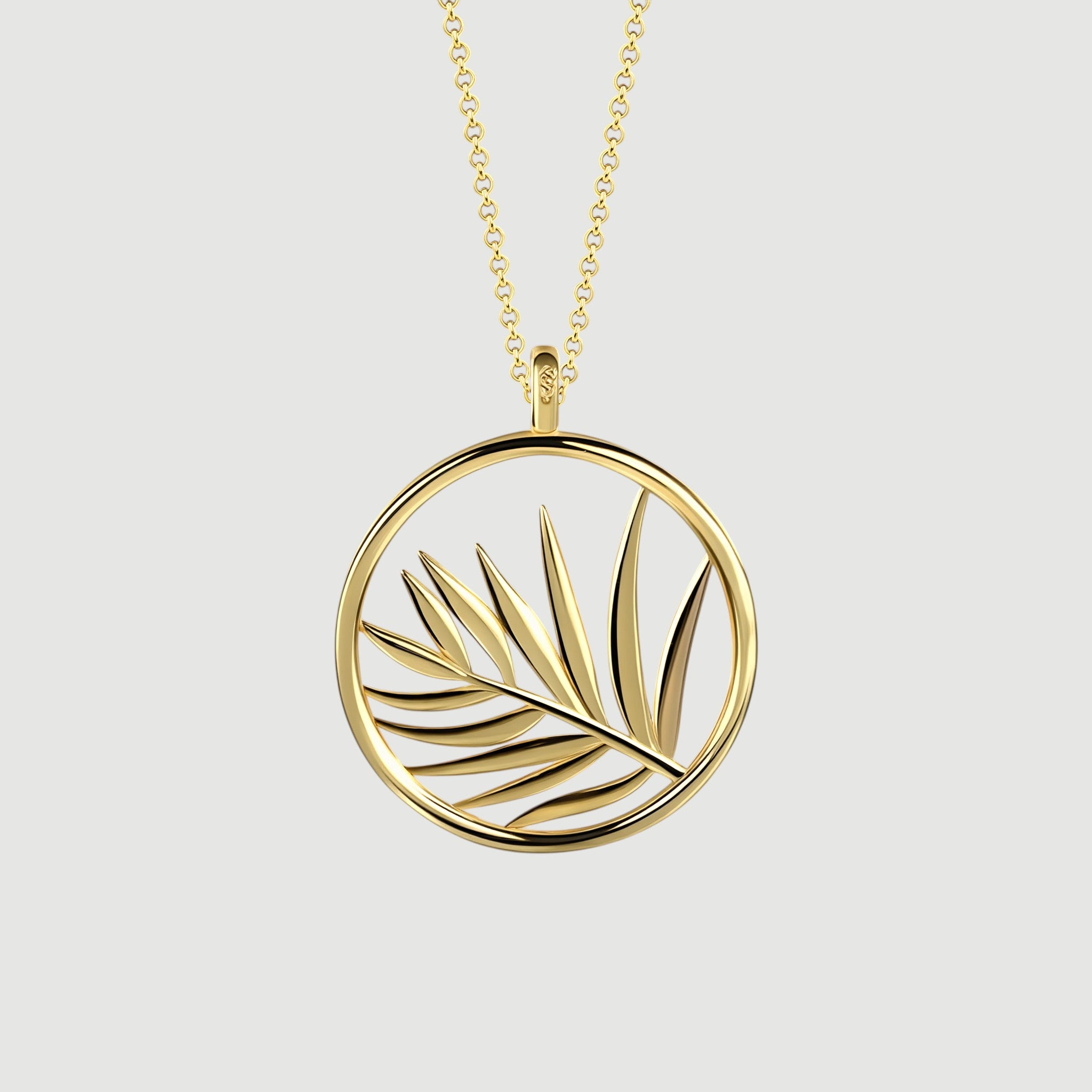 Amara Jewels gold plated sterling silver necklace with open circle palm leaf pendant.