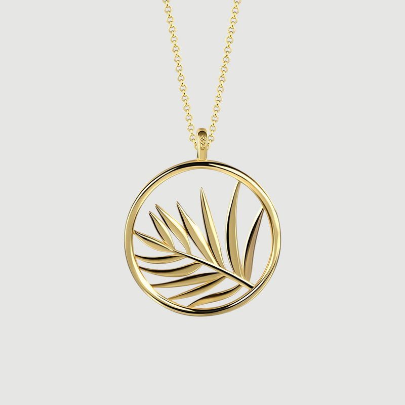 Amara Jewels gold plated sterling silver necklace with open circle palm leaf pendant.
