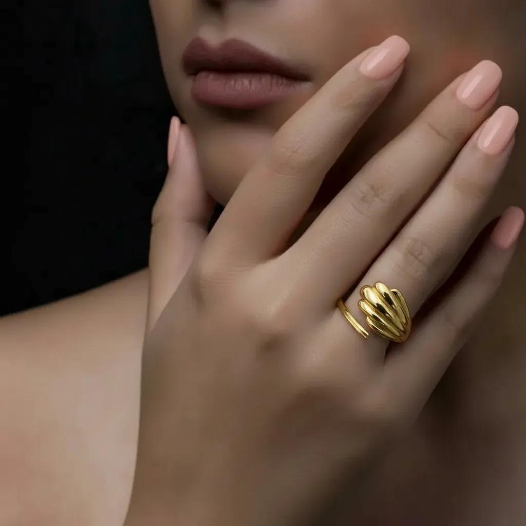 Amara Jewels gold shell open ring with wing design, polished finish, adjustable fit.