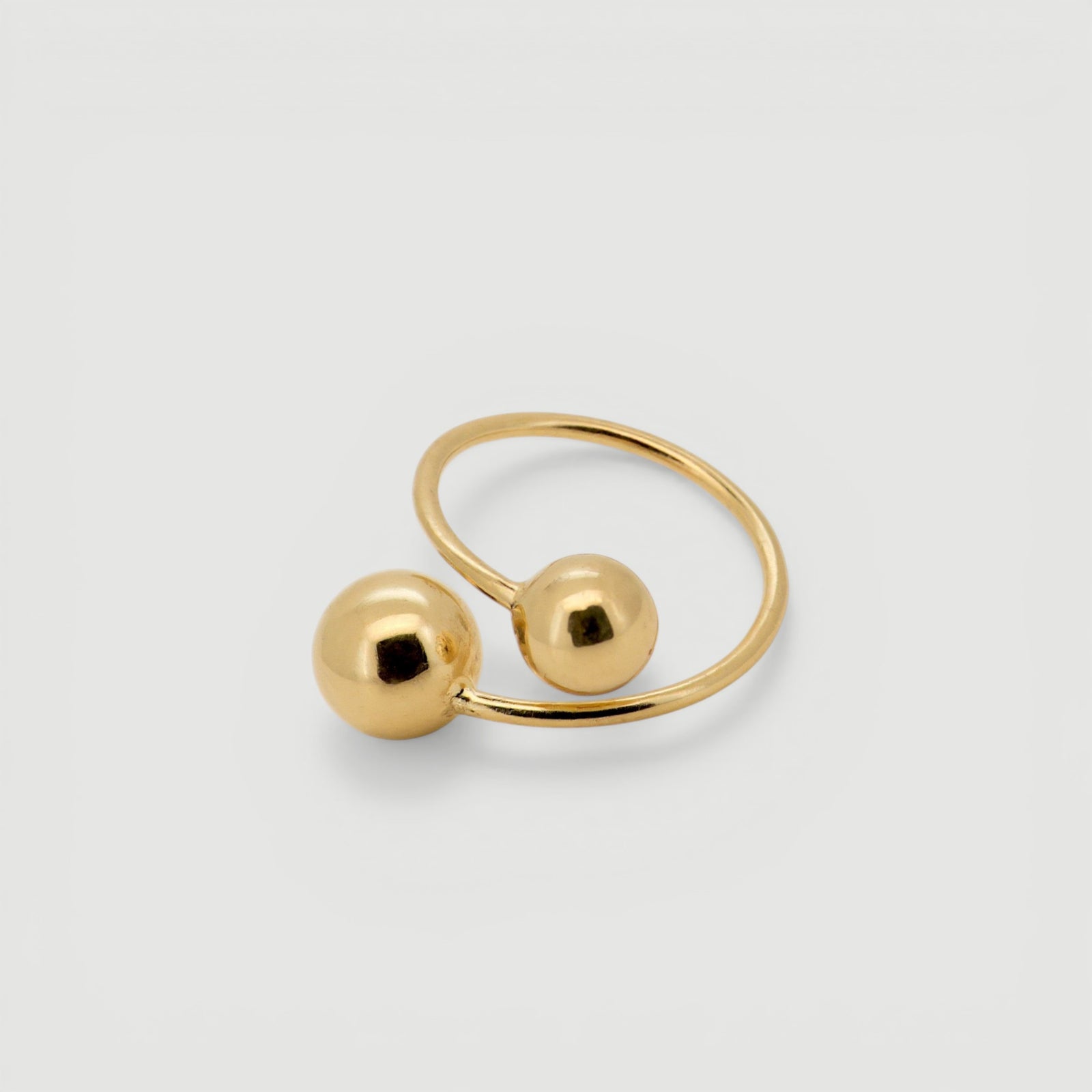 Amara Jewels bold Twin Sphere statement ring in 18K gold plated sterling silver with two polished spheres.