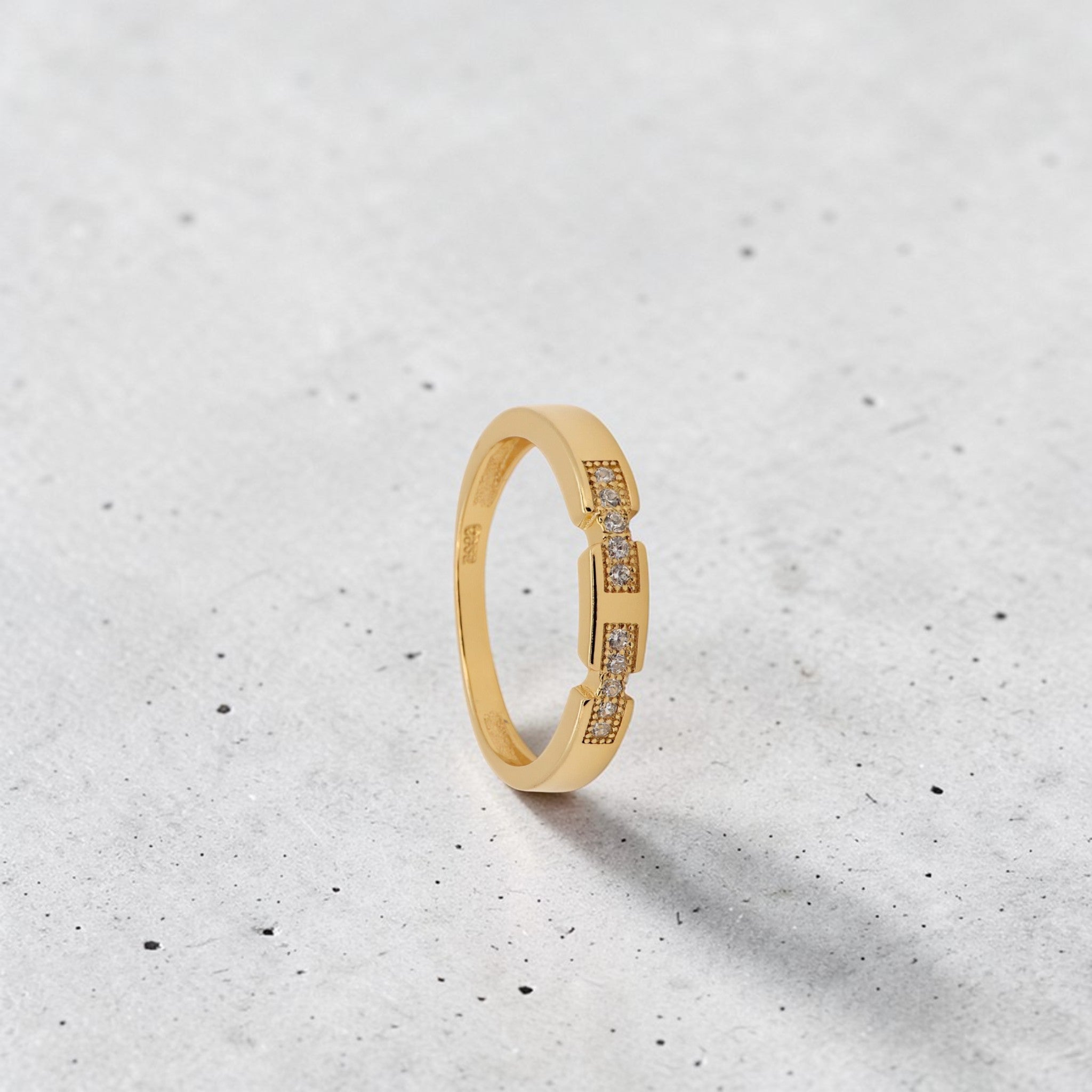 Amara Jewels minimalist gold stacking ring with white zircon stones, crafted from 18K gold plated sterling silver.