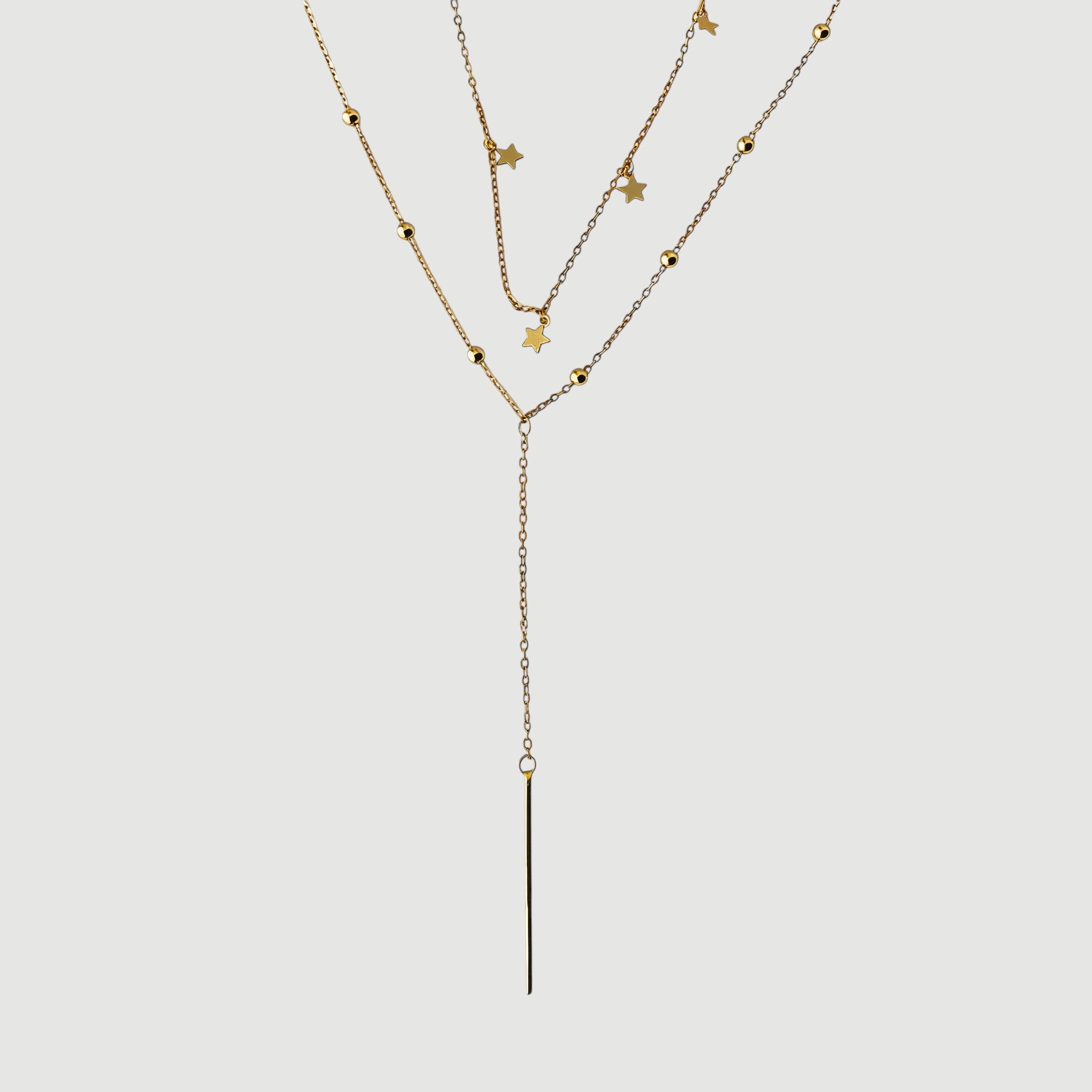 Amara Jewels gold finish sterling silver lariat necklace with star charms and bead accents, featuring a bar drop.
