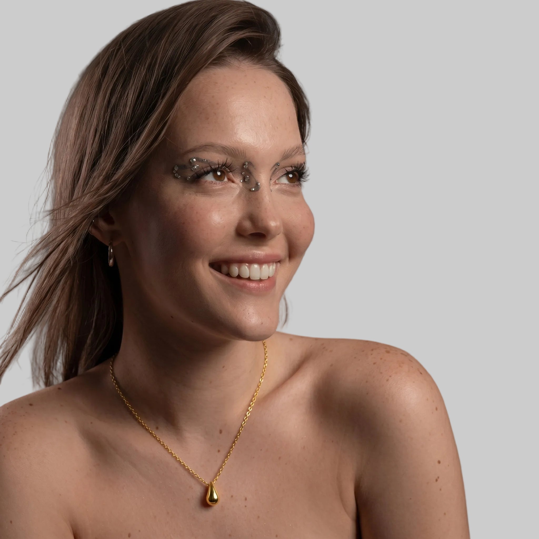 Amara Jewels gold tone teardrop pendant necklace on a dainty chain, made of 925 sterling silver.