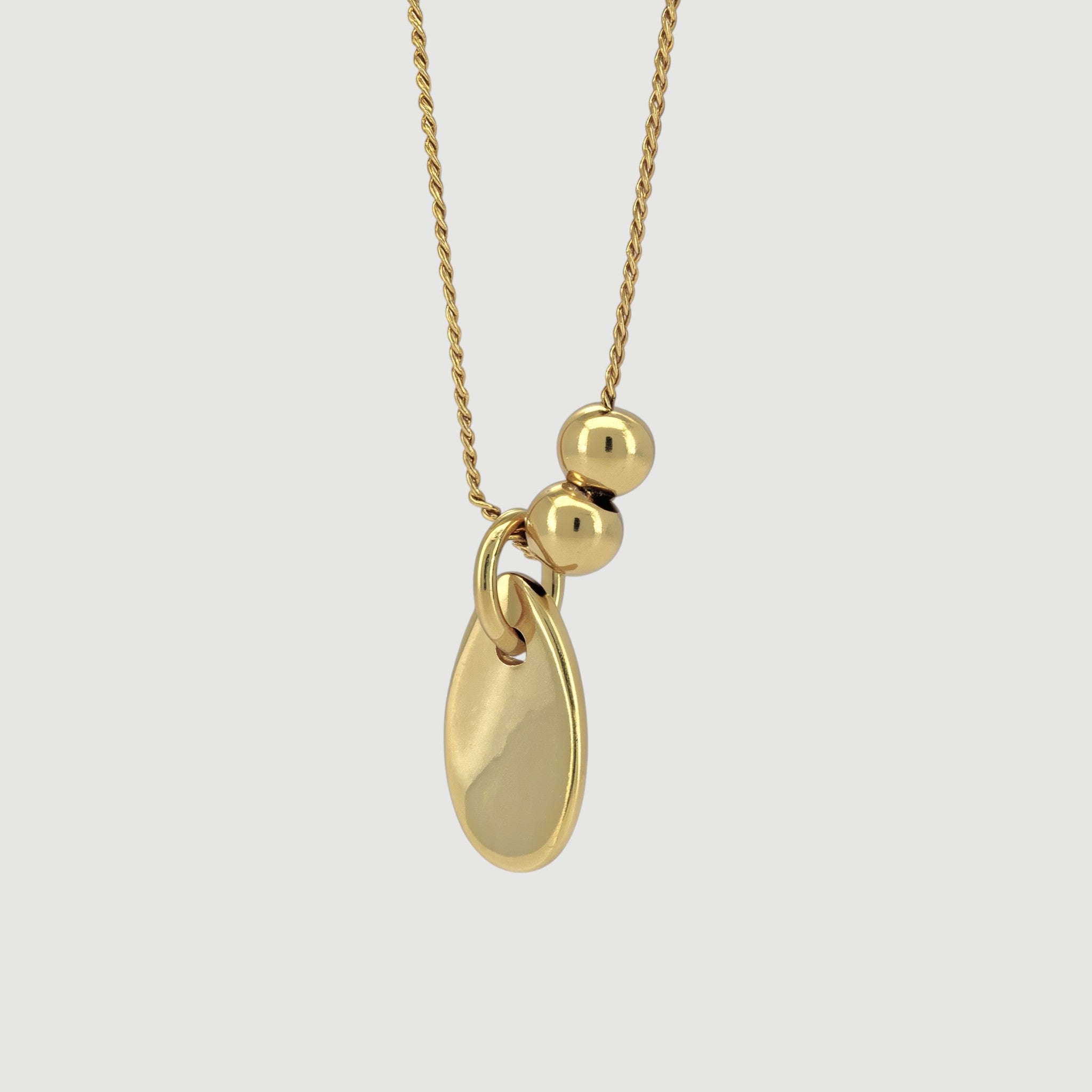 Amara Jewels 18K yellow gold polished sterling silver teardrop pendant necklace with two smooth beads on a delicate chain.